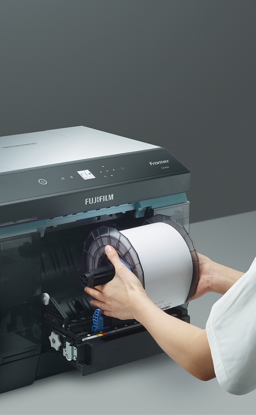 Loading a roll of photo paper into the FUJIFILM Frontier DX400W printer